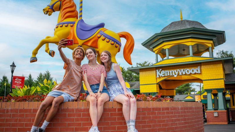 Front of Kennywood with happy guests.